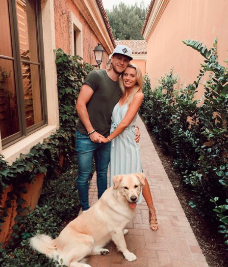 Emily Freguson with her boyfriend William Karlsson and a dog.